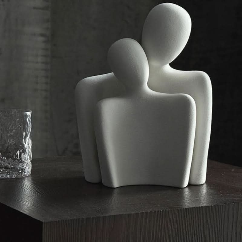Modern sculpture symbolizing connection and tenderness 